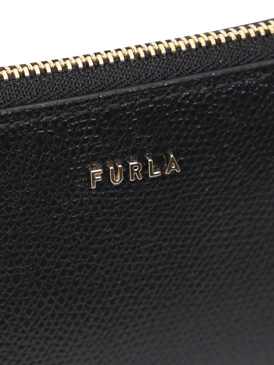 Комплект кожаных косметичек